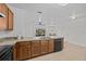 Kitchen with dark wood cabinets and black appliances at 355 Highcrest Rd, Davenport, FL 33896