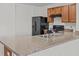 Kitchen with dark wood cabinets and black appliances at 355 Highcrest Rd, Davenport, FL 33896