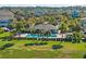 Community pool with surrounding landscape and cabana at 355 Highcrest Rd, Davenport, FL 33896