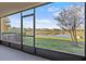 Spacious screened porch overlooking a pond and community at 355 Highcrest Rd, Davenport, FL 33896