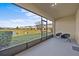 Screened porch with pond and community view at 355 Highcrest Rd, Davenport, FL 33896