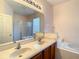 Double vanity bathroom with soaking tub and shower at 3634 Northwoods Dr, Kissimmee, FL 34746