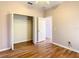 Bedroom with wood flooring and large closet at 3634 Northwoods Dr, Kissimmee, FL 34746