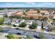 Aerial view of a residential neighborhood with houses and tree-lined streets at 4603 Cumbrian Lakes Dr, Kissimmee, FL 34746