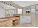 Double vanity, large soaking tub, and walk-in shower at 4603 Cumbrian Lakes Dr, Kissimmee, FL 34746