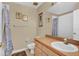 Bathroom with light brown vanity and shower/tub combo at 4603 Cumbrian Lakes Dr, Kissimmee, FL 34746