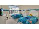 Two twin beds, TV, and plenty of natural light at 4603 Cumbrian Lakes Dr, Kissimmee, FL 34746