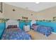 Two twin beds and charming Winnie the Pooh decor at 4603 Cumbrian Lakes Dr, Kissimmee, FL 34746