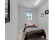 Small bedroom with single bed and neutral decor at 4603 Cumbrian Lakes Dr, Kissimmee, FL 34746