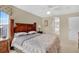 King-size bed, ensuite bathroom access, and wood furniture at 4603 Cumbrian Lakes Dr, Kissimmee, FL 34746