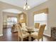 Elegant dining room with a glass-top table and comfortable seating at 4603 Cumbrian Lakes Dr, Kissimmee, FL 34746