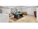 Finished garage with pool table, foosball, and laundry at 4603 Cumbrian Lakes Dr, Kissimmee, FL 34746