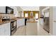 Spacious kitchen with island, stainless steel appliances, and white cabinets at 4603 Cumbrian Lakes Dr, Kissimmee, FL 34746