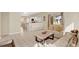 Living area with beige couch and view into kitchen at 4603 Cumbrian Lakes Dr, Kissimmee, FL 34746