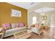 Living room with wicker furniture and a warm color palette at 4603 Cumbrian Lakes Dr, Kissimmee, FL 34746