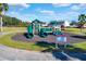 Community playground with green slides and play structures at 4603 Cumbrian Lakes Dr, Kissimmee, FL 34746