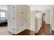 Upstairs hallway with wood flooring and access to bedrooms at 4603 Cumbrian Lakes Dr, Kissimmee, FL 34746