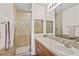 Clean bathroom with shower, tiled walls, and a vanity at 4731 Hemingway House St, Kissimmee, FL 34746