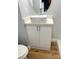 Modern bathroom vanity with marble-look countertop and white cabinets at 5413 Vanderlin St, Orlando, FL 32810