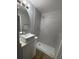 Updated bathroom with gray tile shower and modern vanity at 5413 Vanderlin St, Orlando, FL 32810