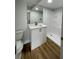 Modern bathroom with white vanity and walk-in shower at 5413 Vanderlin St, Orlando, FL 32810