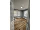 Spacious bedroom with wood-look floors and neutral wall colors at 5413 Vanderlin St, Orlando, FL 32810