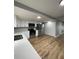 Modern kitchen with stainless steel appliances and white cabinets at 5413 Vanderlin St, Orlando, FL 32810