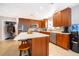 Modern kitchen with stainless steel appliances and an island at 5804 Defiance Ave, Orlando, FL 32839