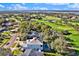 Aerial view of home in golf community with a pool, near the water at 6018 Tarawood Dr, Orlando, FL 32819