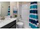 Clean bathroom with tub shower combo, vanity, and toilet at 691 Drop Shot Dr, Davenport, FL 33896