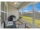 Relaxing screened porch with patio furniture and backyard view at 859 Vienna Dr, Winter Haven, FL 33884