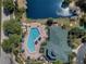Aerial view of the community pool and clubhouse at 9051 Treasure Trove Ln # 207, Kissimmee, FL 34747