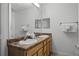 Double vanity bathroom with wood cabinets at 9051 Treasure Trove Ln # 207, Kissimmee, FL 34747