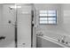 Bathroom with shower, bathtub, and updated fixtures at 9051 Treasure Trove Ln # 207, Kissimmee, FL 34747