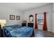 Guest bedroom with two twin beds and wood flooring at 9051 Treasure Trove Ln # 207, Kissimmee, FL 34747