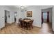 Small dining area with a wooden table and wicker chairs at 9051 Treasure Trove Ln # 207, Kissimmee, FL 34747