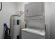 Laundry area with stackable washer and dryer at 9051 Treasure Trove Ln # 207, Kissimmee, FL 34747