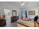 Main bedroom with king bed and en-suite bathroom at 9051 Treasure Trove Ln # 207, Kissimmee, FL 34747