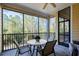 Screened porch with outdoor seating at 9051 Treasure Trove Ln # 207, Kissimmee, FL 34747