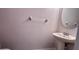 Small half bathroom with toilet and vanity at 9536 Muse Pl, Orlando, FL 32829