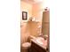 Bathroom with sink, toilet and shelving at 101 Whitehall Way, Kissimmee, FL 34758