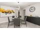 Modern dining room with glass table, gray chairs, and statement art at 119 Candlewick Rd, Altamonte Springs, FL 32714