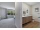 Modern bathroom with double vanity and a view to bedroom at 17114 Blessing Dr, Clermont, FL 34714