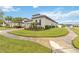 Well-maintained house with a side yard and curved sidewalk at 1880 Goblet Cove St, Kissimmee, FL 34746