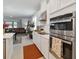 Modern kitchen with stainless steel appliances and white cabinets at 1880 Goblet Cove St, Kissimmee, FL 34746