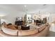 Open-concept living area featuring a large sectional sofa at 1880 Goblet Cove St, Kissimmee, FL 34746