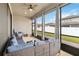 Relaxing screened porch with outdoor seating and a view of the backyard at 1880 Goblet Cove St, Kissimmee, FL 34746