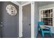 Condo entry with gray door, teal chair, and holiday wreath at 2022 Royal Bay Blvd # 94, Kissimmee, FL 34746