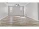 Bright living room with hardwood floors and ceiling fan at 24 Altera Ct, Kissimmee, FL 34758