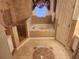 Bathroom featuring a corner jacuzzi tub and shower at 2606 Royal Fern Pl, Kissimmee, FL 34758